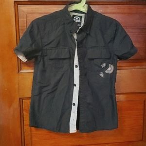 Black button down shirt with embroidered pocket.